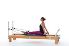 <p><strong>Setup</strong></p><ul><li><p>Sitting upright at front edge of carriage, facing risers, legs straight between shoulder rests, arms straight and forward of trunk, hands in straps, palms facing back</p></li><li><p>Resistance: light to medium | <strong>Springs: 1B or 1R</strong></p></li></ul><p><strong>Movement</strong></p><ul><li><p>Exhale: Move arms back</p></li><li><p>Inhale: Move arms forward, return to start positon</p></li></ul><p><strong>Muscle Focus</strong></p><ul><li><p>Shoulder extensors</p></li><li><p>Elbow extensors</p></li><li><p>Scapular stabilizers</p></li><li><p>Spinal extensors</p></li></ul><p><strong>Objectives</strong></p><ul><li><p>Shoulder extensor strength</p></li><li><p>Elbow extensor strength</p></li><li><p>Scapular stabilization</p></li><li><p>Trunk stabilization</p></li></ul><p><strong>Cues</strong></p><ul><li><p>Keep trunk upright and stable</p></li><li><p>Keep arms straight throughout</p></li><li><p>Move arms 20 degrees forward and 20 degrees back of trunk</p></li></ul><p></p>