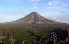 <p>a composite volcanic cone built of interlayered lava flows and pyroclastic materials</p>