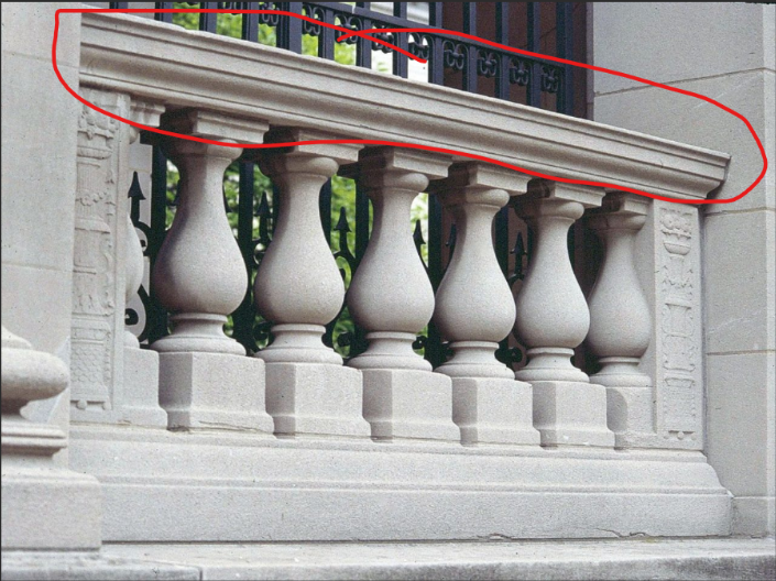 <p>A handrail beside a stairway.</p>