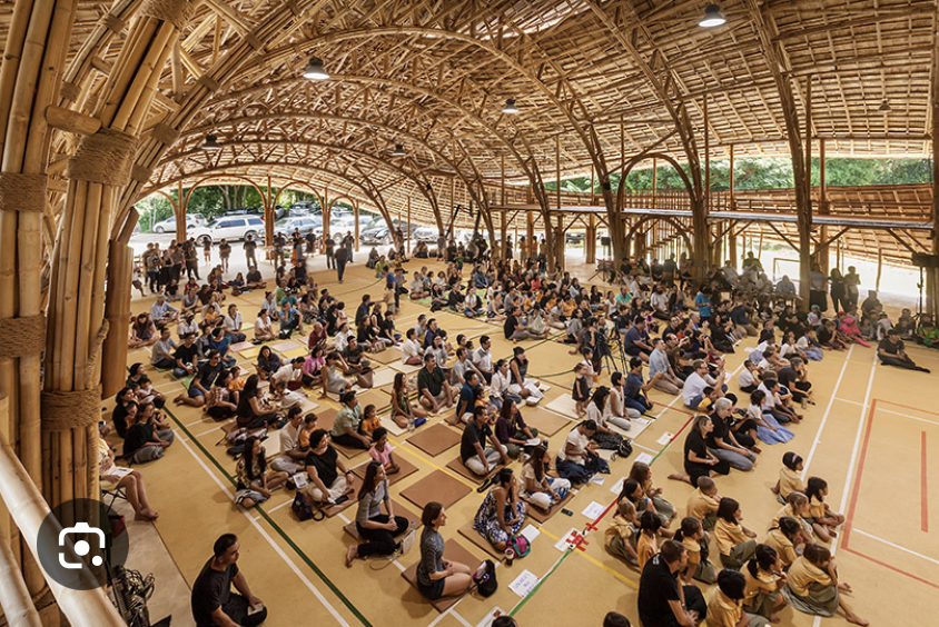 <p>Chiang Mai, Thailand, Panyaden School, 2017 arch.: Chiangmai Life Architects &amp; Construction</p><ol><li><p><span><strong>Sustainable Engineering Milestone:</strong> The sports hall achieves a zero-carbon footprint by using treated bamboo that absorbs more CO2 than emitted during construction, showcasing a viable, low-carbon alternative to modern steel and concrete.</span></p></li><li><p><span><strong>Innovative Organic Design:</strong> Inspired by the lotus flower to reflect the school's Buddhist principles, the structure uses innovative, 17-meter prefabricated bamboo trusses without steel connectors to create a safe, open-span sports arena.</span></p></li><li><p><span><strong>Climate-Resilient Architecture:</strong> Designed to handle hot and wet climates, the building offers natural ventilation for a cool, comfortable interior while meeting modern safety standards for high-speed winds and earthquakes</span></p></li></ol><p></p>
